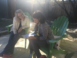 Carmen working with student Eliza Kinkz at Austin's Writing Barn.
