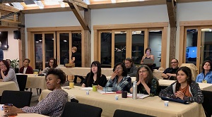 Diversity Fellowship attendees at tables.