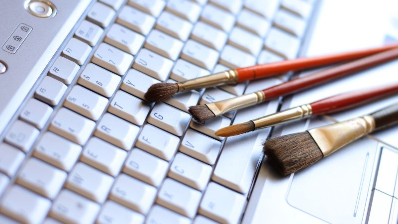 keyboard and paintbrushes