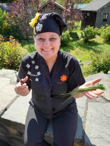 Chef Amanda Holding Herbs from the Garden
