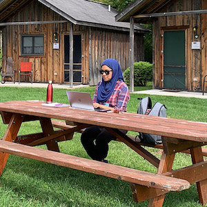 working-at-picnic-table Zaynah working at a picnic table