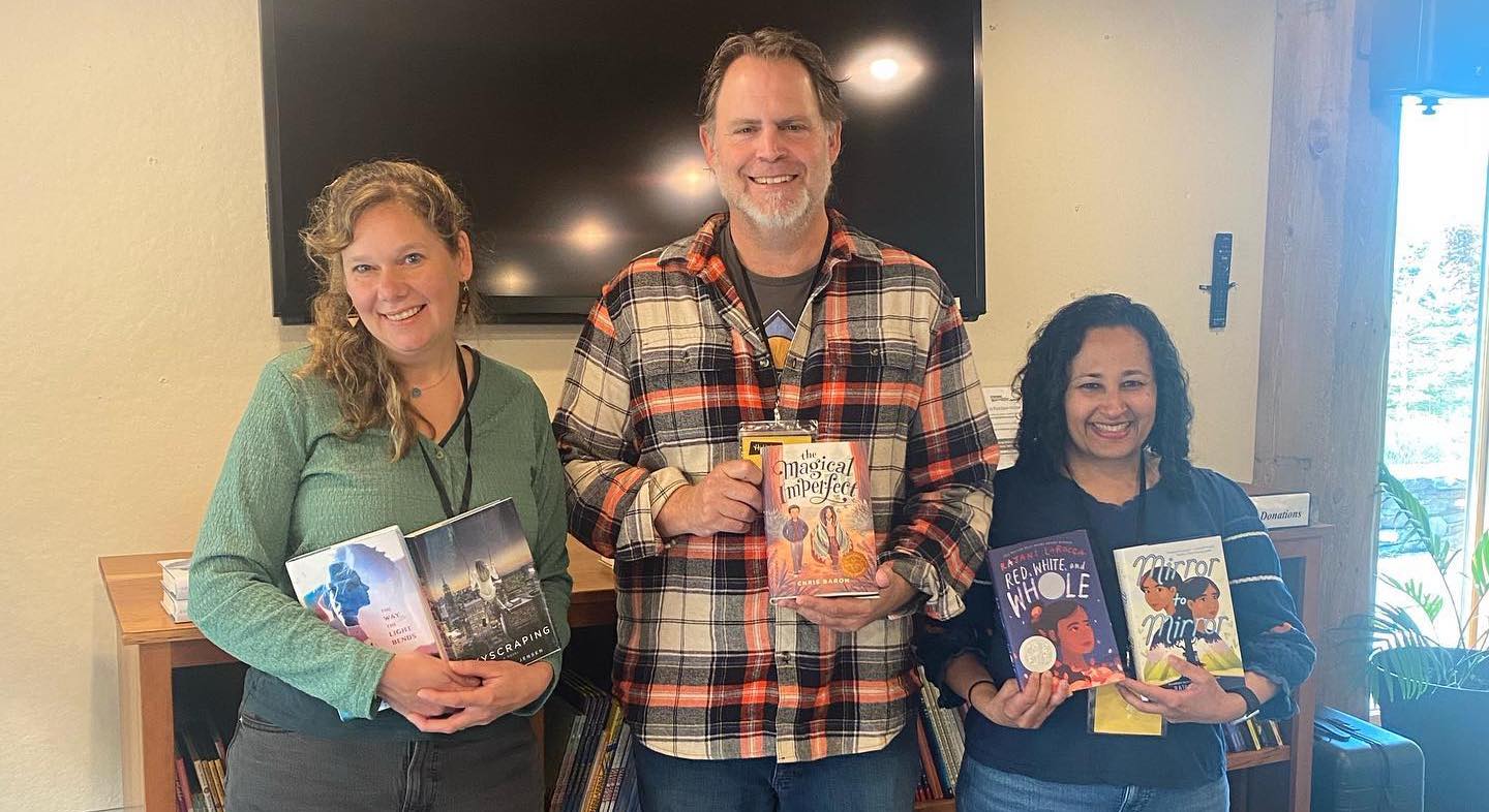 Cordelia on campus with her books, Chris and Rajaini.