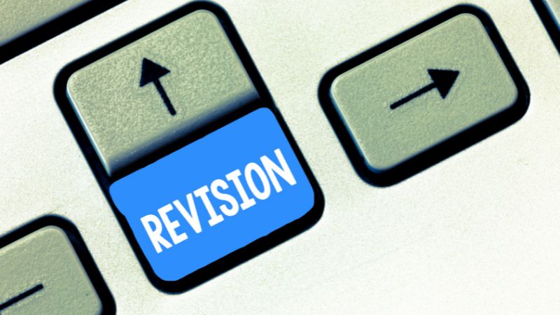 The word revision on a blue computer key with arrows.
