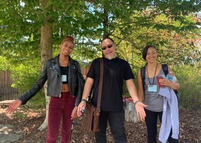 Floyd with two people on campus outside