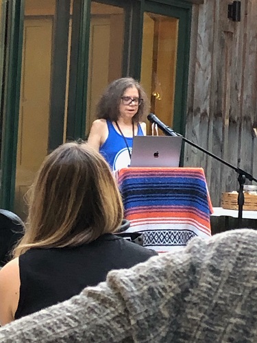 Photo of Karol Ruth Silverstein reading aloud