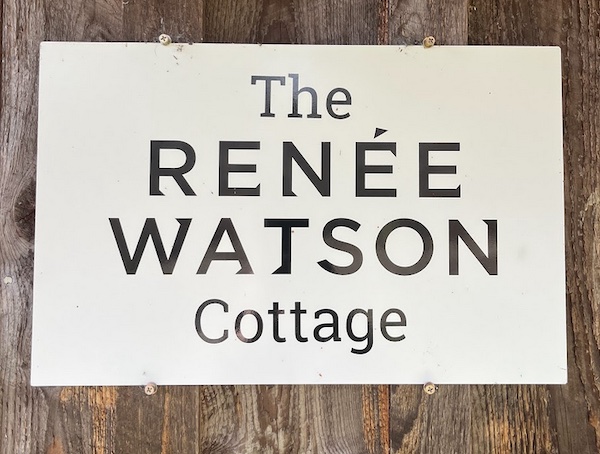 Sign saying: The Renée Watson Cottage