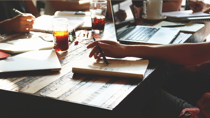 writers at a table