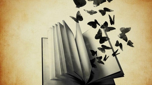 Image of open book with butterflies rising from the pages