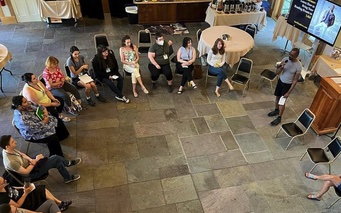 Retreat attendees sitting in a circle in the Barn