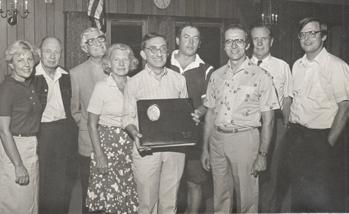 Photo of Jerry Wiseman with Highlights staff celebrating 28 years with the magazine