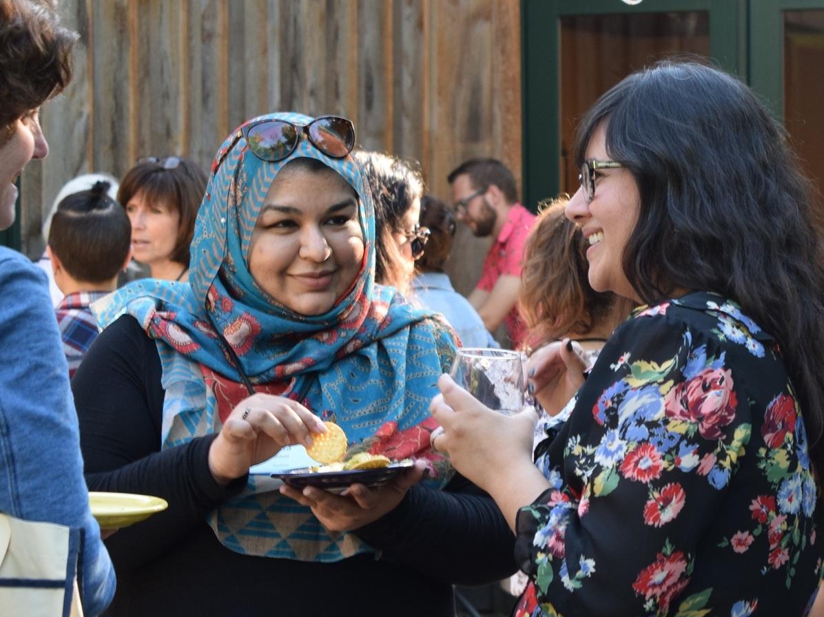 Photo of Summer Camp attendees talking on the patio