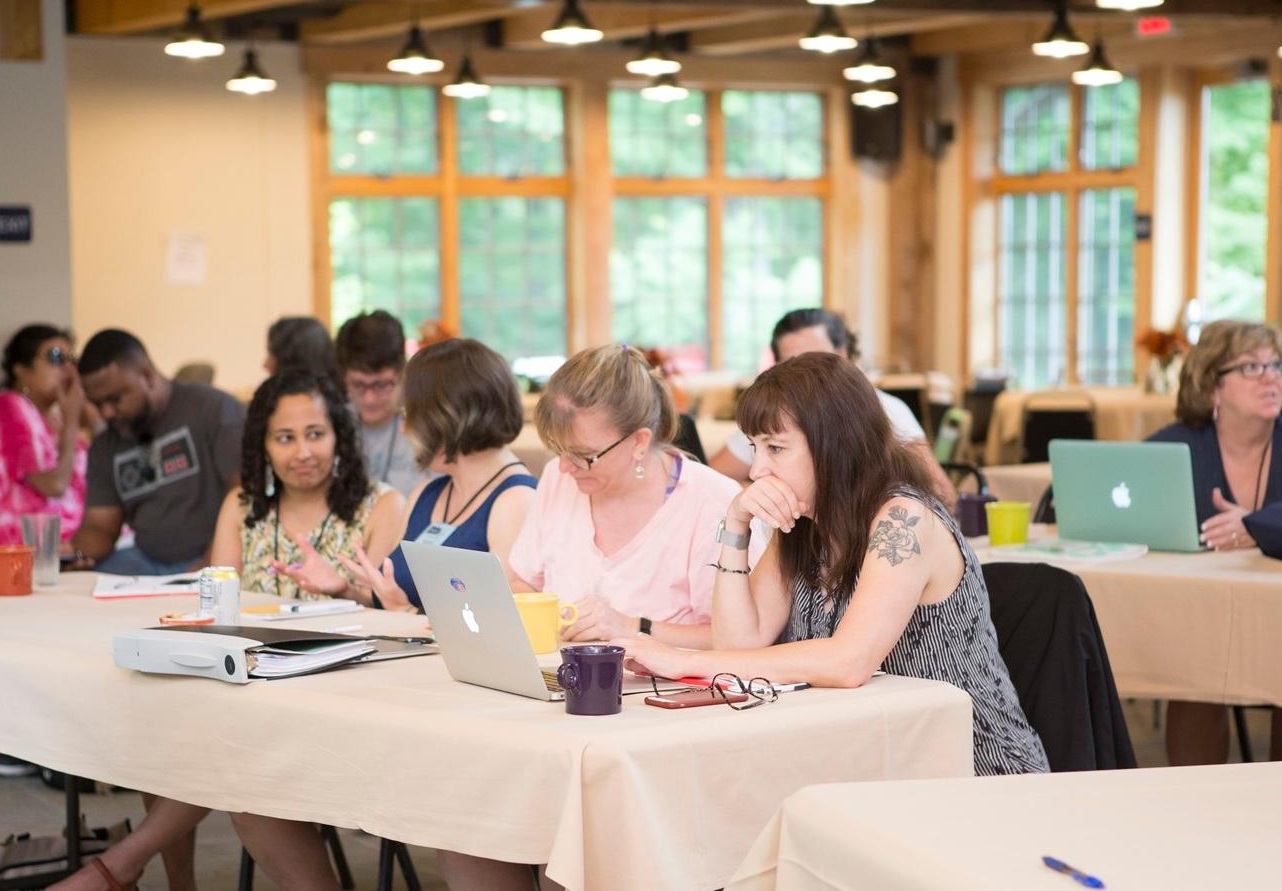 Photo of Summer Camp attendees working in a small group